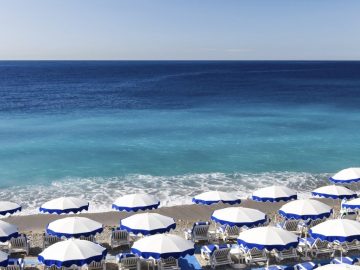 Beautiful Nice beach with umbrellas